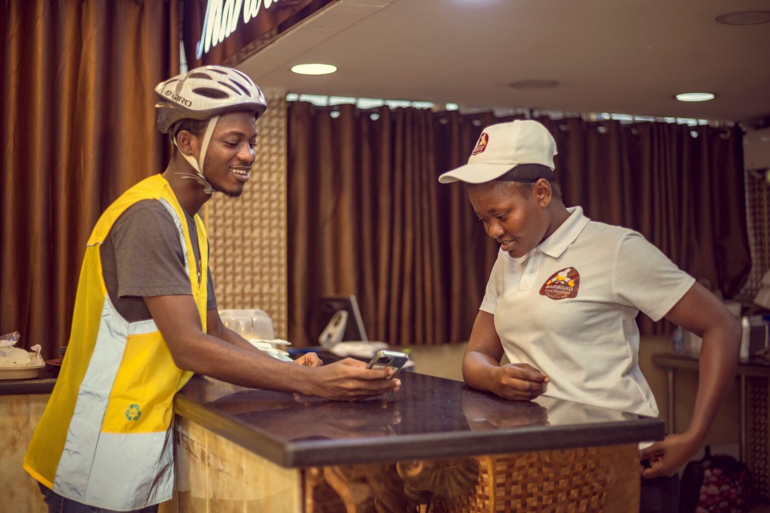 Glovo rider at a vendor shop