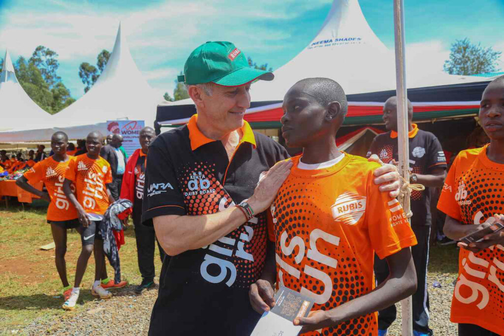 Deborah Chemutai of AIC Cheptonon Secondary School was celebrated by the RUBiS Energy Kenya Group Managing Director - Mr. Jean Christian Bergeron after winning the 4km Girls Run during the RUBiS GirlsRun at Kapsisiywa Primary School, Nandi County to support menstrual health