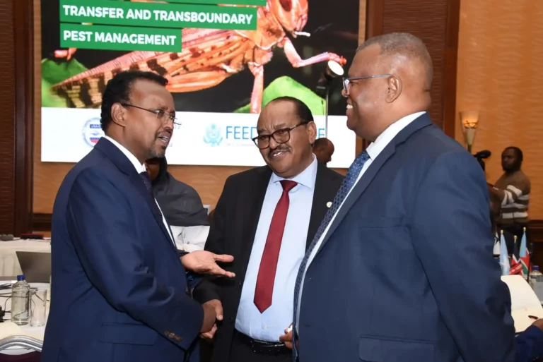 IGAD Climate Prediction and Application Centre Director Dr Guleid Artan, IGAD Head of Agriculture and Food Security Moyeldeen Eltohami and UNHCR Principal Advisor on Solutions confer during the IGAD Ministerial Meeting on Risk Transfer and Transboundary Pest Management.