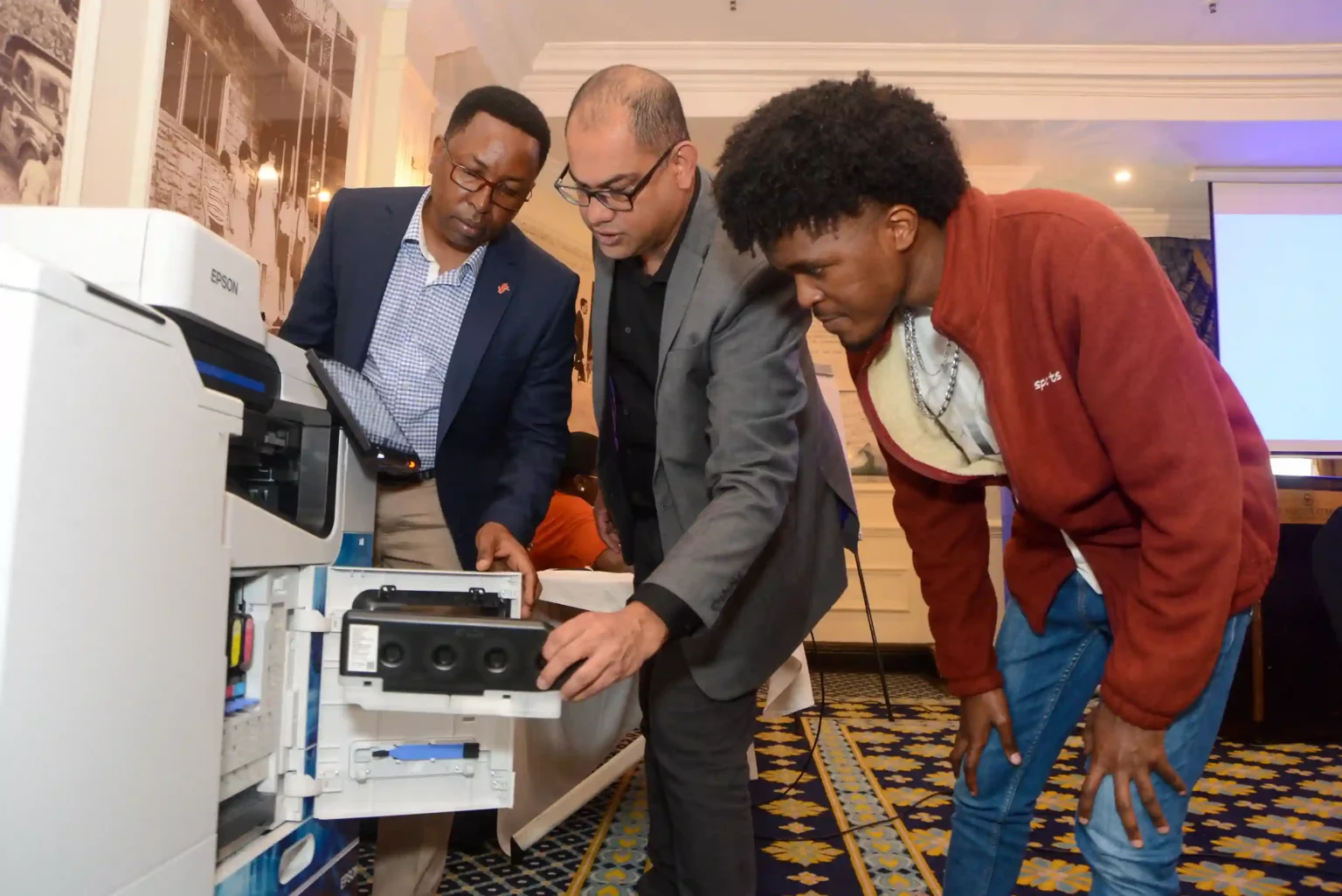 (L-R) Centre for Mathematics,Science and technology Education In Africa Martin Mungai, Epson Regional Head East for East and West Africa Mukesh Bector and CEO vision Drill kenya Ian Muthomi.