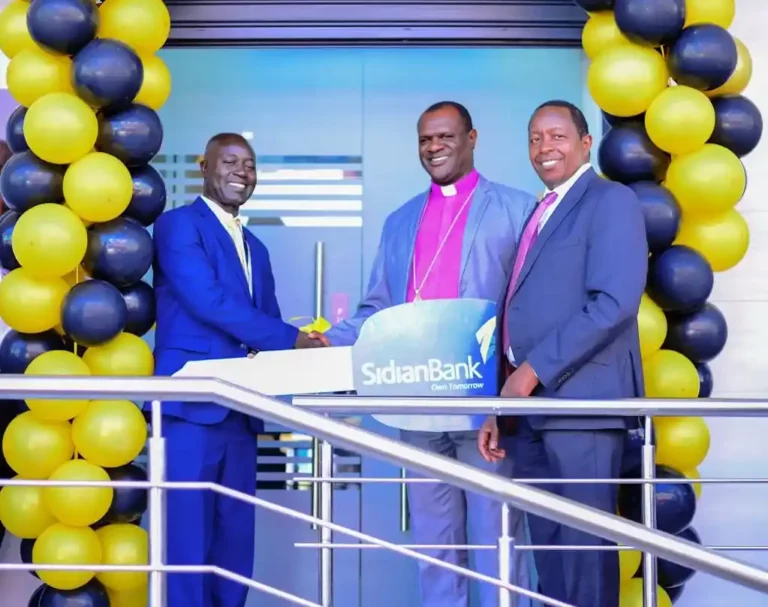 L-R Vitalis wekesa branch manager Kakamega ,Bishop Charles Asilutwa and Chege Thumbi CEO Sidian Bank at the launch of Sidian Bank in Kakamega County.