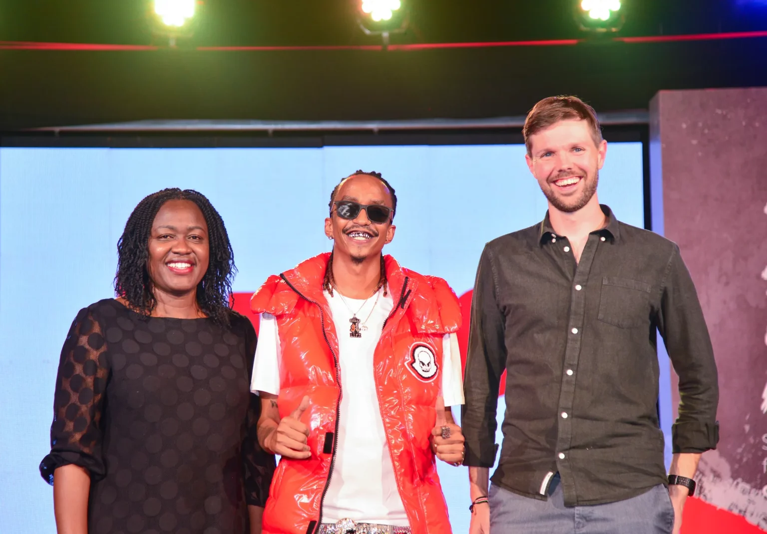 L-R: Dr. Senorine Wasike, Head of Marketing at Kenya Wine Agencies Limited (KWAL), celebrity musical artist Boutross, and Jonas Geeraerts, Commercial Director at KWAL during the re-launch of Kibao Vodka. Boutross was unveiled as the Kibao Vodka Brand Ambassador to champion an ongoing marketing campaign.