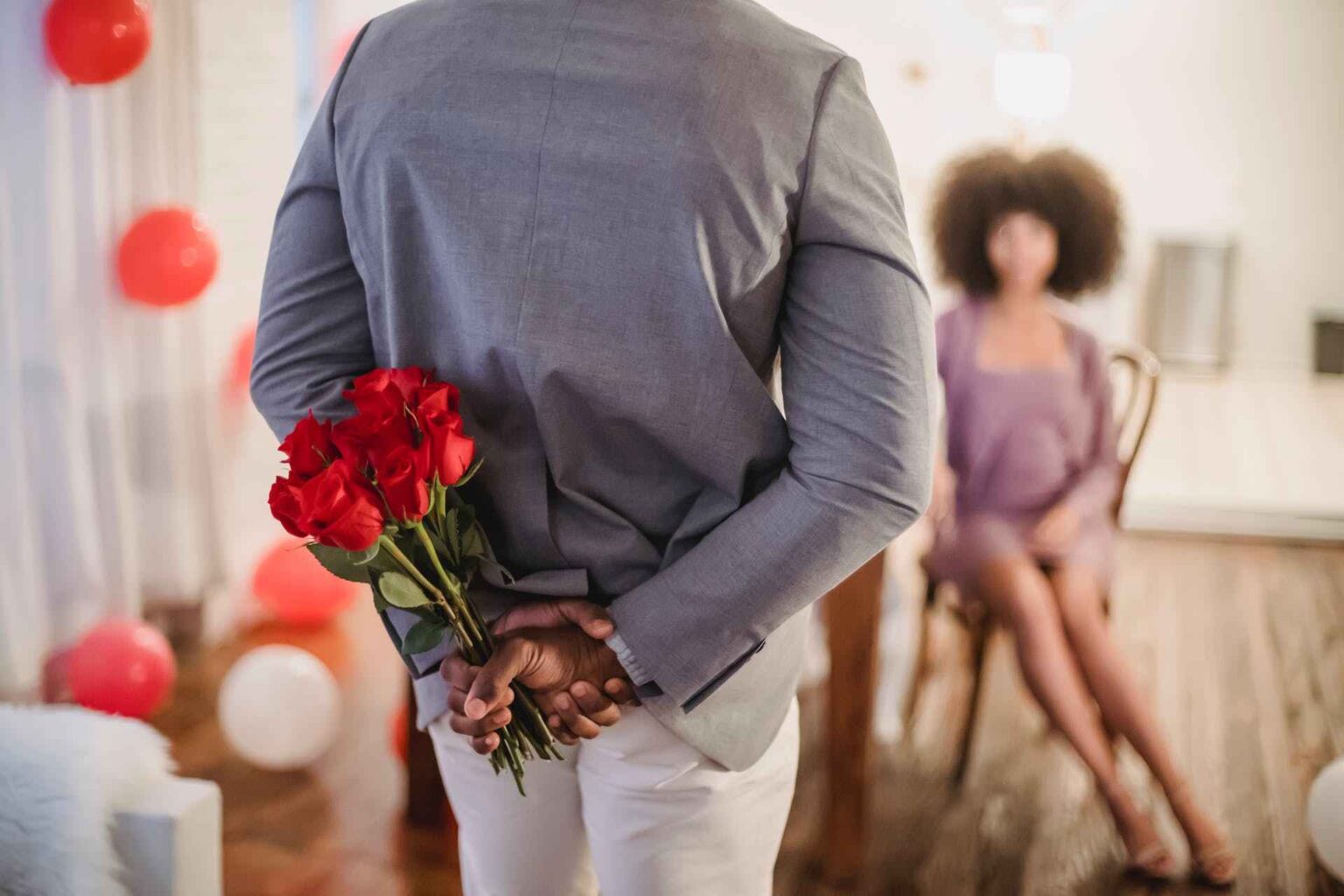 Man Surprising Woman With A Bouquet Of Flowers during Valentine's Day