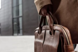 Photo of a Person's Hand Holding a Handbag