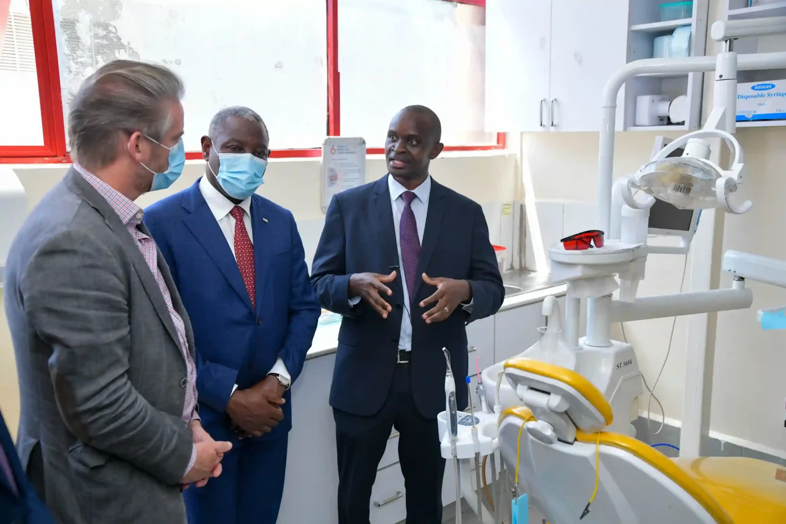 Dr. Anthony Kinyanjui (right), the medical officer in charge of Equity Afia Buruburu, explains to the French Ambassador to Kenya, H.E Arnaud Sequet (left) and Equity Group Foundation Executive Chairman Dr. James Mwangi (middle) how Equity Afia uses state-of-the-art equipment to ensure delivery of quality healthcare.