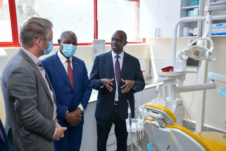 Dr. Anthony Kinyanjui (right), the medical officer in charge of Equity Afia Buruburu, explains to the French Ambassador to Kenya, H.E Arnaud Sequet (left) and Equity Group Foundation Executive Chairman Dr. James Mwangi (middle) how Equity Afia uses state-of-the-art equipment to ensure delivery of quality healthcare.