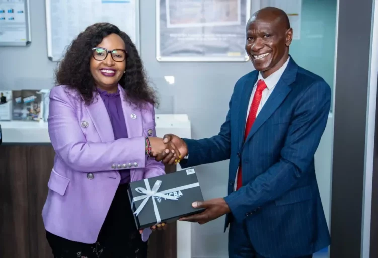 NCBA Group Director Marketing, Communication and Citizenship Ms. Nelly Wainaina hands over a gift to a Customer during the NCBA Limuru Branch Opening Ceremony held at Mumbi House, Limuru Town