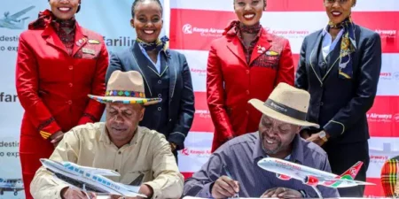 Safarilink Aviation Chief Executive Officer Mr Alex Avedi and Allan Kilavuka, Managing Director and Chief Executive Officer Kenya Airways, sign one-way codeshare partnership agreement.
