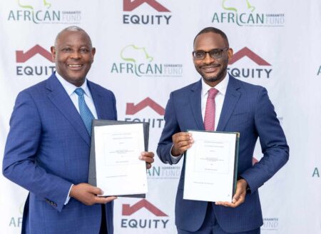 Equity Group CEO James Mwangi and AGF CEO Jules Ngankam sign the $500M deal to support small businesses.