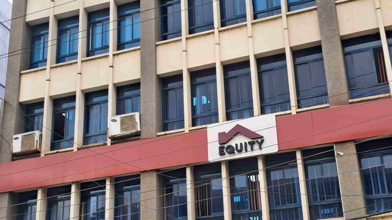 Equity Group Holdings H1 2025 Financial Performance: Regional Subsidiaries Drive Profit Growth A multi-story building with a sign that reads "EQUITY" and features a logo of a house with a maroon roof.