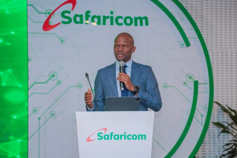 Frankline Okata speaking at Safaricom Innovation Day, addressing enterprise clients at Michael Joseph Centre