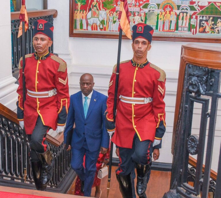 Munyiri’s Allegations Fall Flat as LSK Clears Advocate Cecil Miller of Any Debt Ambassador Peter Munyiri, Kenya’s High Commissioner to India, ascending ceremonial steps behind uniformed guards during an official event.