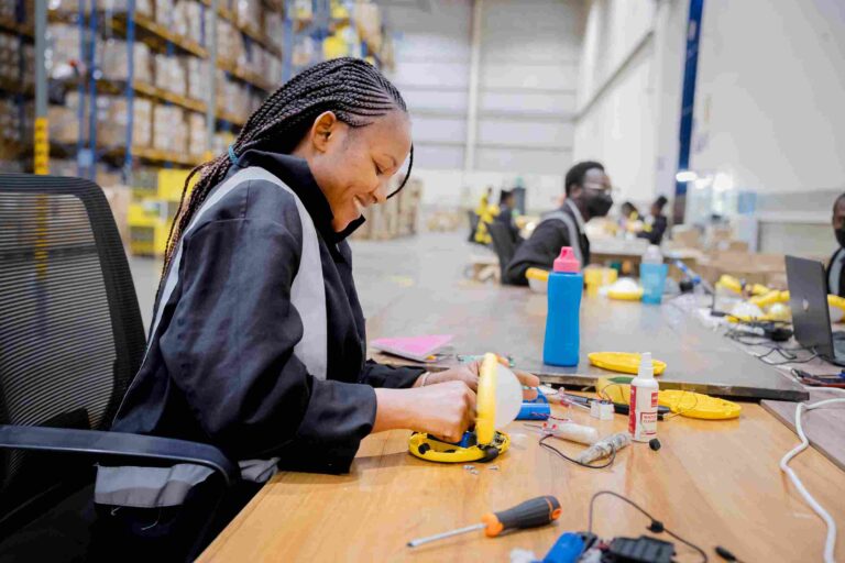 Workers assembling Sun King solar-powered devices at the company’s new manufacturing facility in Tatu City, Kenya.