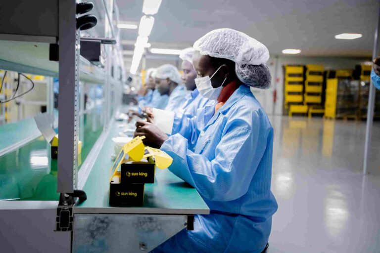 Workers assembling Sun King solar-powered devices at the company’s new manufacturing facility in Tatu City, Kenya.