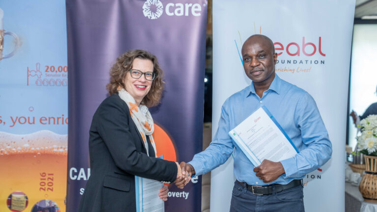 Arthur Mamvura of EABL Diageo Africa with Michelle Nunn of CARE International during MOU signing