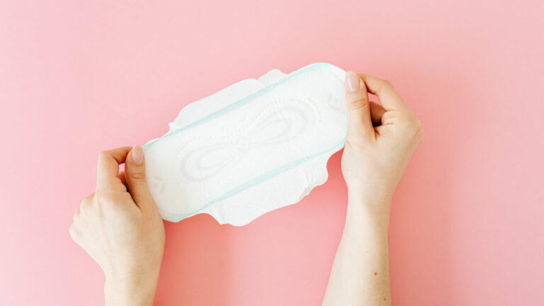 A Person Holding White Sanitary Napkin