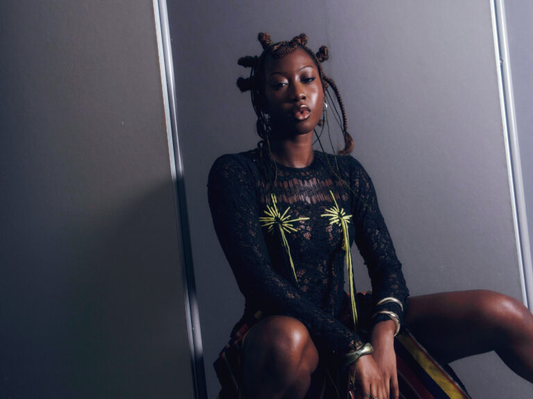 DEELA poses in a promo shot for her 2025 album Wicked