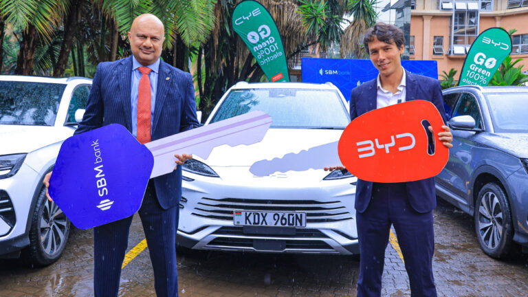 Bhartesh Shah, CEO of SBM Bank Kenya, and Nicolas Ruffier des Aimes, GM of BYD by CFAO Mobility Kenya, at the handover of five BYD plug-in hybrid vehicles in Nairobi