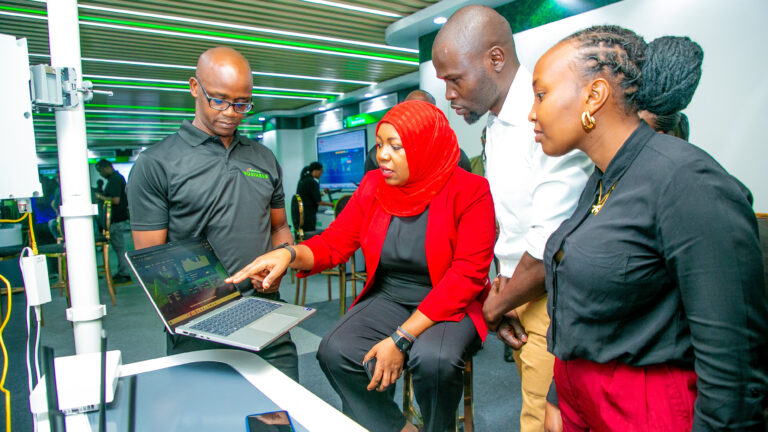 Felix Kariuki, Product Manager Small and Micro Segments at Safaricom, presents internet packages to Chief Consumer Business Officer Fawzia Ali-Kimanthi, Geoffrey Azina, and Fridah Ngendo at the Grow with Safaricom Business showcase held at Huawei Offices in Nairobi.