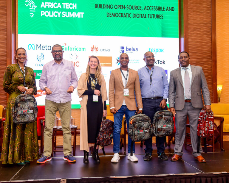 The AfTPS 2026 fireside chat panel in Nairobi, May 2026. From left: Ambassador Bitange Ndemo, Esther Waititu (Safaricom), Caroline Hane-Weijman (Paystack Kenya), Nick Mwendwa (Riverbank Solutions), and Kamau Kunyiha (Creditinfo Group) moderated by Ali Hussein (KICTANet).