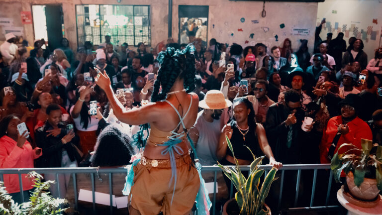 Crowd filming a live performance at Assembly Lite during Greasy Tunes Nairobi