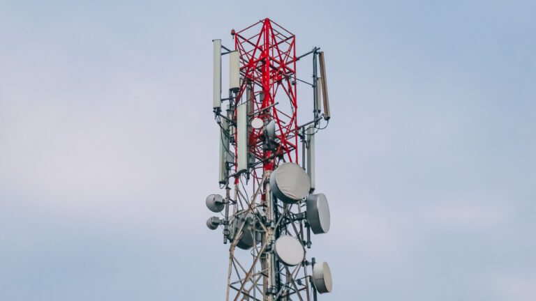 Telecommunications tower with antennas and dishes used for mobile network coverage