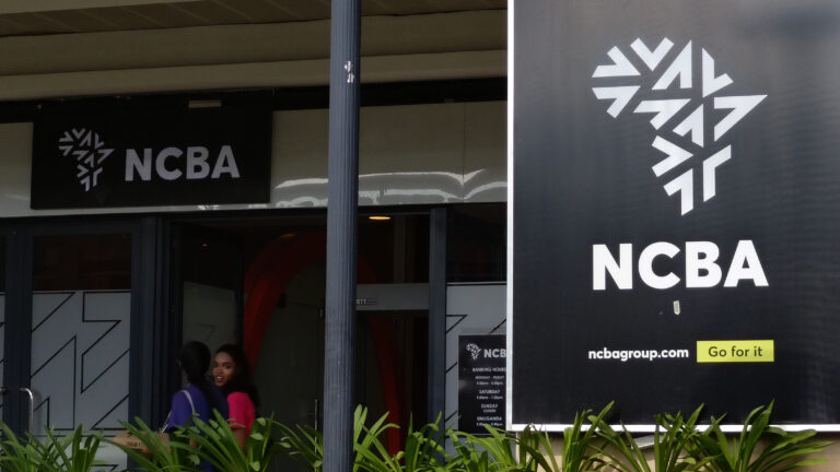 NCBA Bank branch entrance with banking hours signage in Kigali