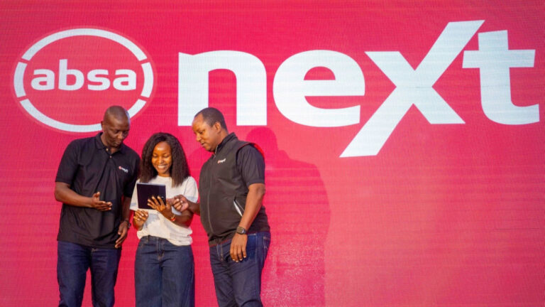 Yusuf Omari and Sitoyo Lopokoiyit look at a tablet on stage below the Absa Next logo during the app launch