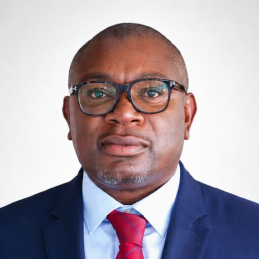 Kenya Airways hands the top job to its lawyer, again Portrait of Habil Waswani, Kenya Airways' newly appointed acting Group Managing Director and CEO, wearing a dark suit and red tie.