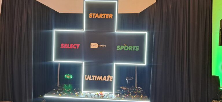 DStv Kenya Replaces Packages With Four New Tiers Lit cross shaped display showing DStv Starter, Select, Sports and Ultimate around the DStv Expect+ logo